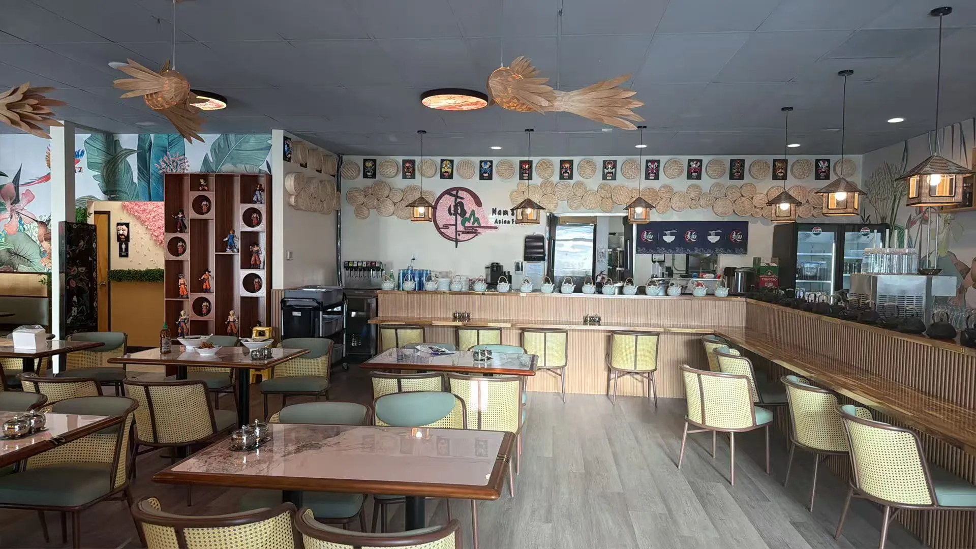 Spacious restaurant interior with rattan seating, wooden bar and woven bird ceiling light fixtures at Namson Asian Fusion , an Asian Fusion Restaurant in Redmond